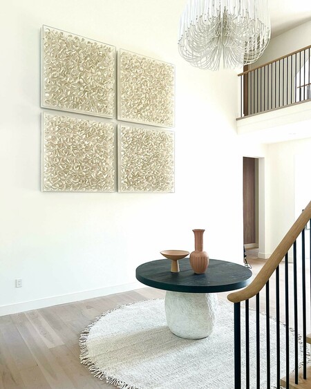 Hand-cut coco wood in petal forms in off-white finish with a clear