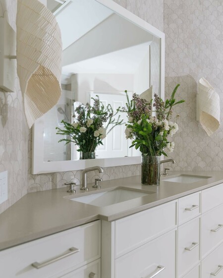 Hand-sewn wood beads are formed into a delicate helix over a cream