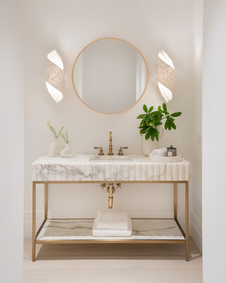 Hand-sewn wood beads are formed into a delicate helix over a cream