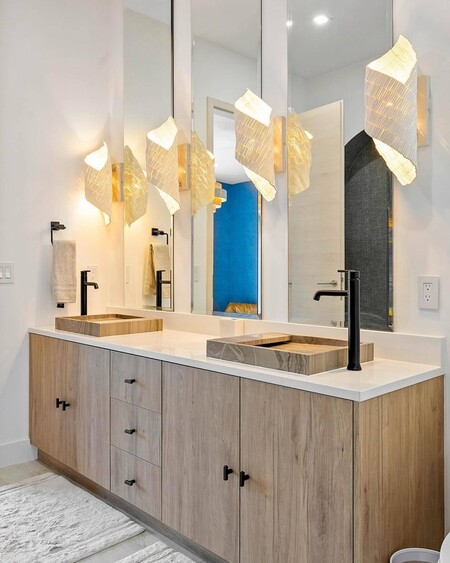 Hand-sewn wood beads are formed into a delicate helix over a cream