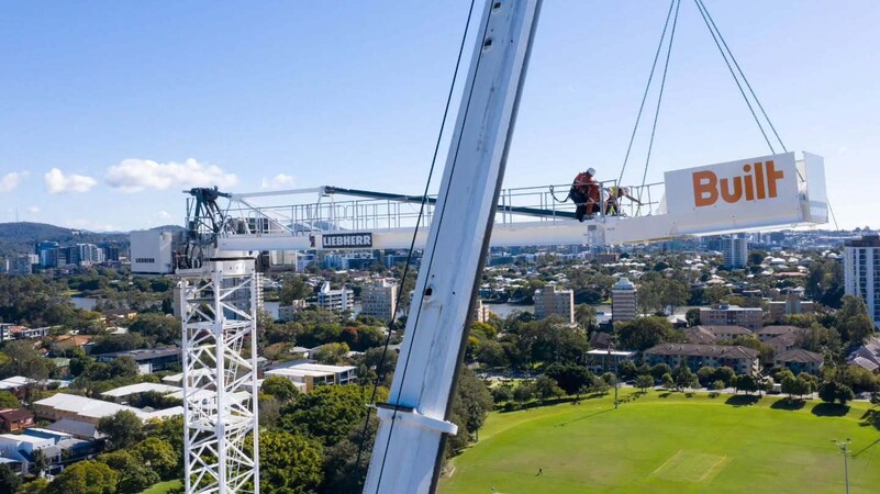 image by liebherrtowercranes containing crane, man, person, city, job