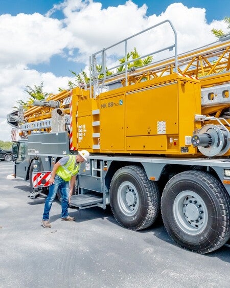 image by liebherrusa containing truck, man, job, worker, yellow