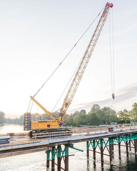image by liebherrusa containing crane, bridge, water, dock, yellow