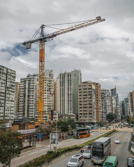 image by liebherrconstruction containing crane, building, road, city, bus