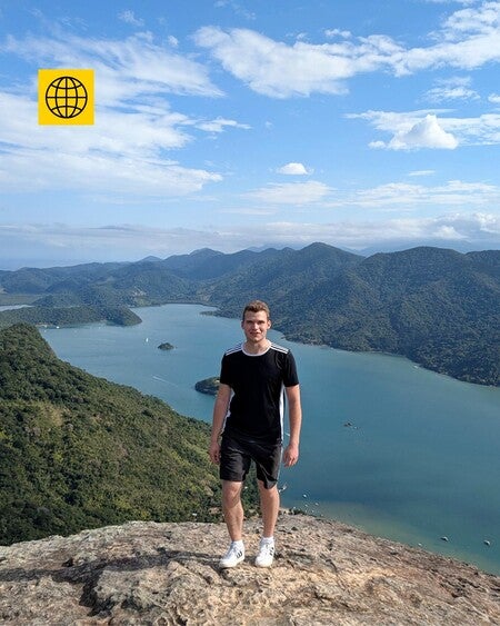 image by liebherrcareers containing man, stand, peak, mountain, lake