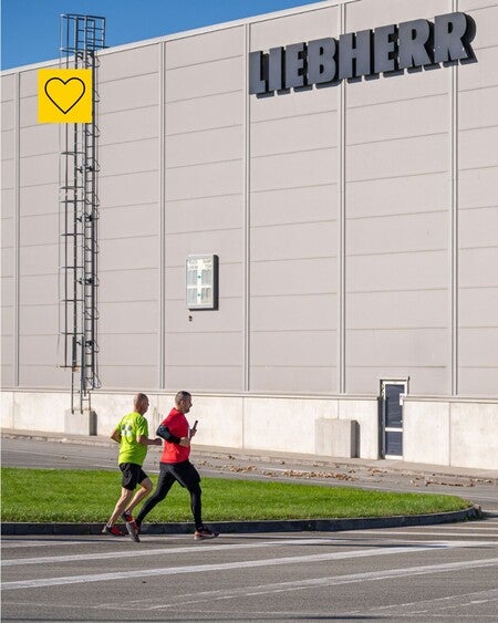 image by liebherrcareers containing run, person, man, road, building