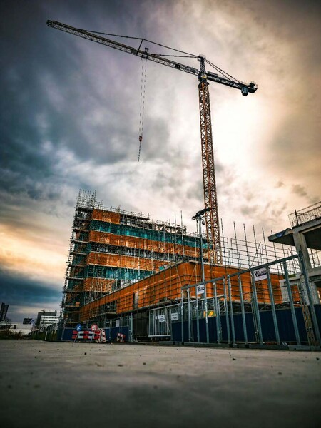 image by anonymous containing building, crane, build, construction site, sky