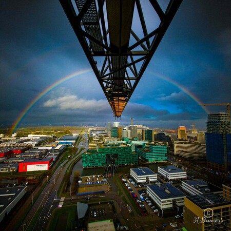 image by anonymous containing city, bridge, rainbow, building, sky