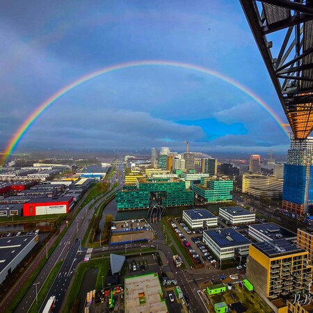 image by anonymous containing city, rainbow, building, sky, city skyline