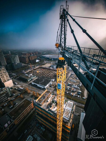 image by anonymous containing crane, building, city, build, construction site