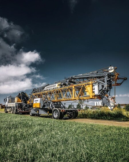 image by liebherrusa containing field, crane, truck, grass, green