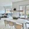image by Signify containing living room, table, white, chair, dinning table